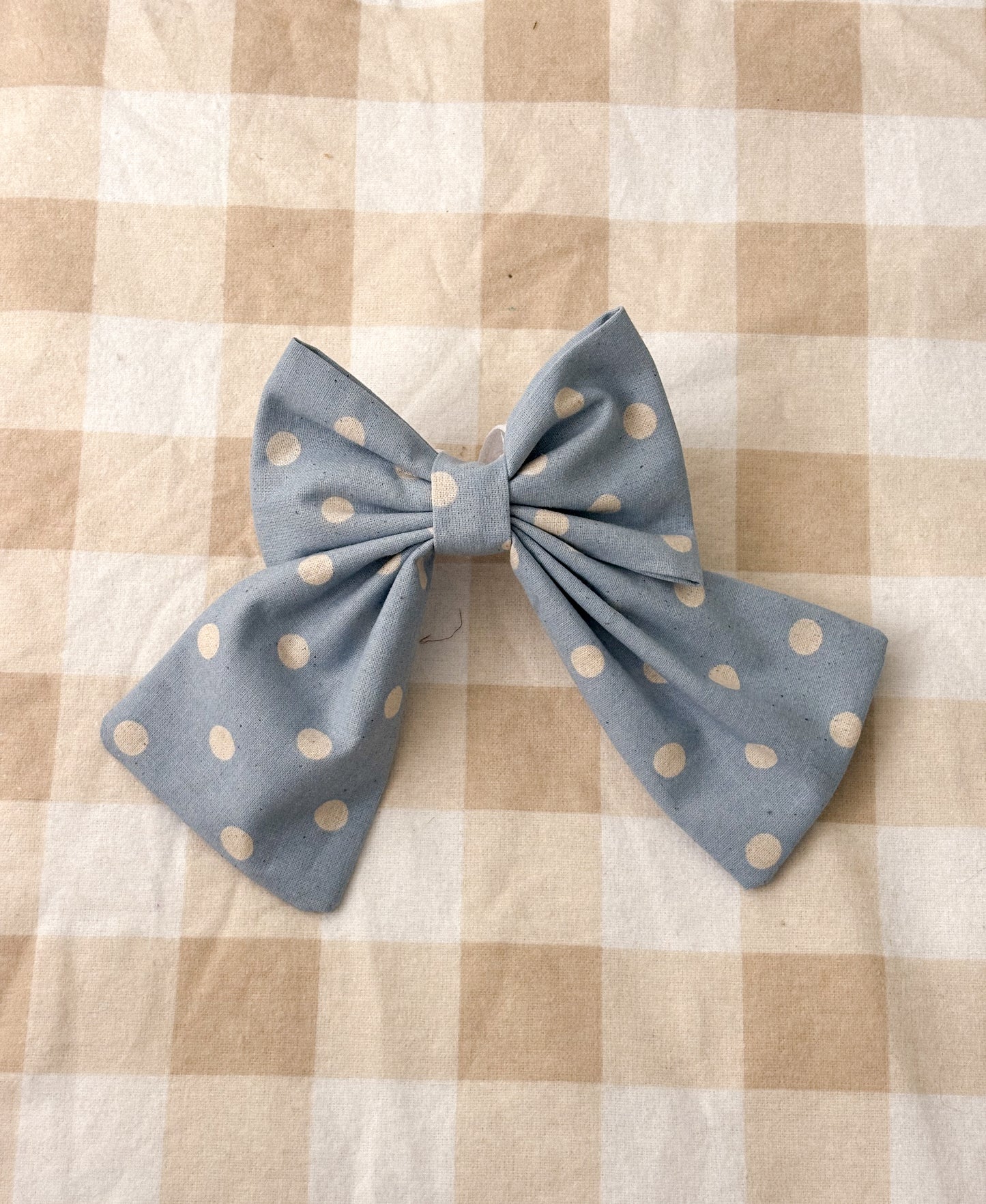 Blue polka dot bow